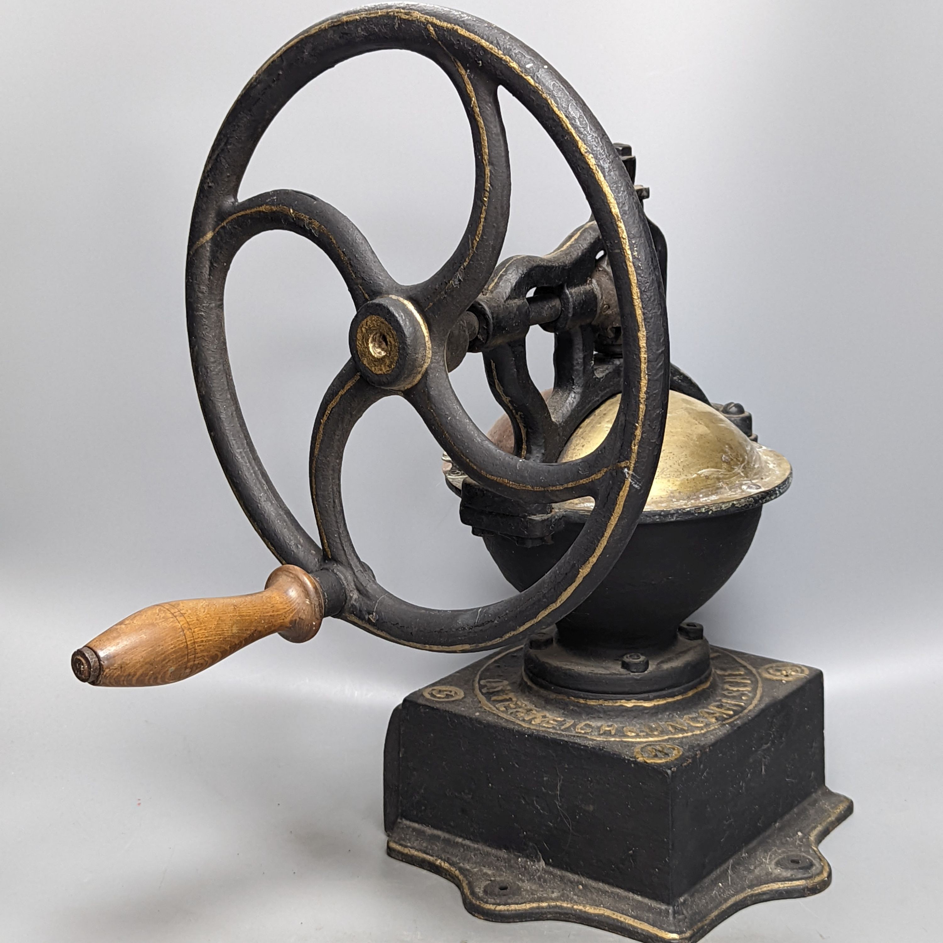 An Austrian cast iron and copper coffee grinder 45cm